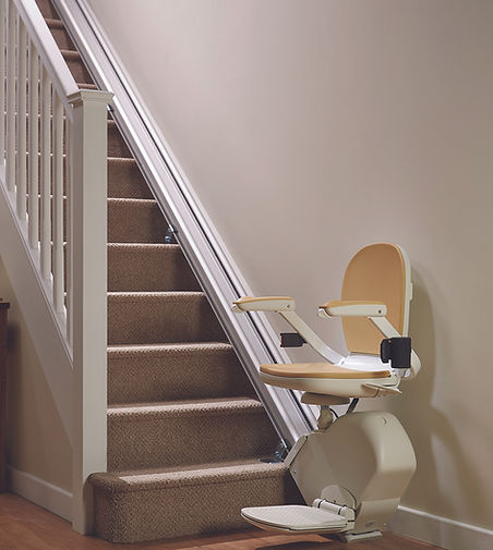 Stairlift chair installed on carpeted home stairs for accessibility.